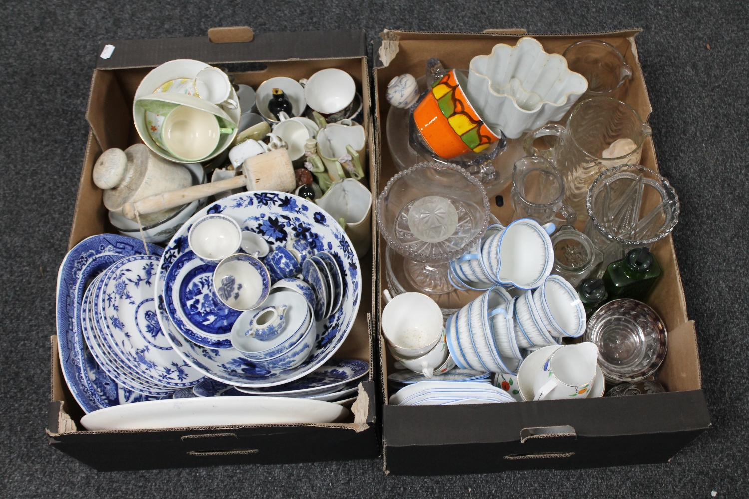 Two boxes of blue and white willow pattern china, pressed glass,
