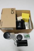 A box containing two boxed Ricoh CX1 digital cameras, Ricoh KR-10 Super camera,