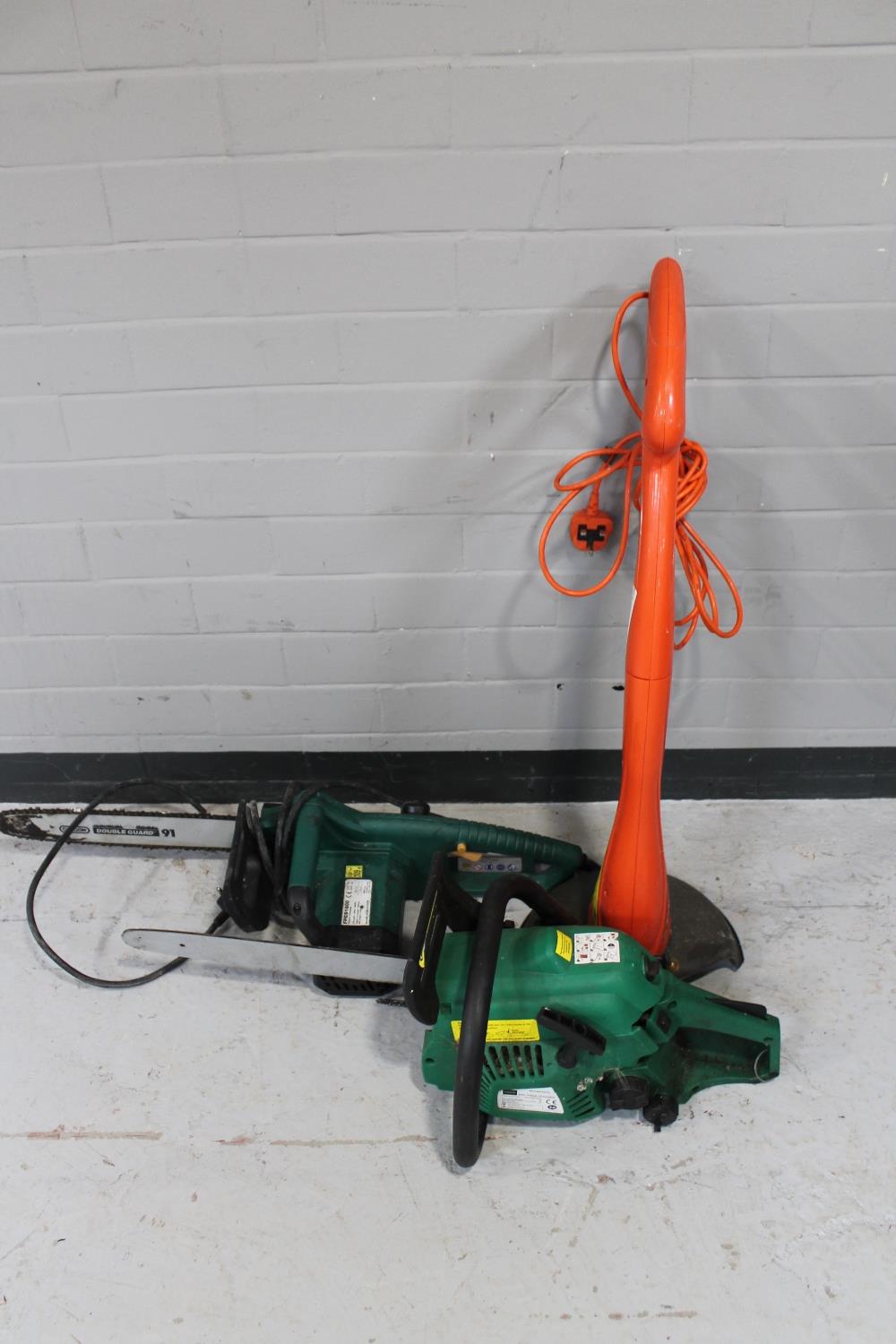 Two chain saws and a Flymo grass strimmer