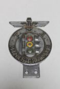 A car badge marked T.M.A.