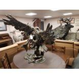 A cast patinated aluminium figure - eagle,