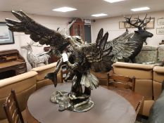 A cast patinated aluminium figure - eagle,