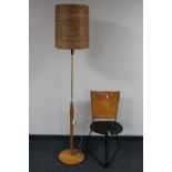 A late 20th century standard lamp and a Terna style chair with leather hide back rest,