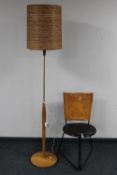 A late 20th century standard lamp and a Terna style chair with leather hide back rest,