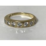 An 18ct gold seven stone brilliant cut diamond ring, approximately 0.