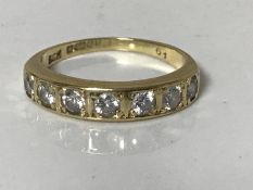 An 18ct gold seven stone brilliant cut diamond ring, approximately 0.