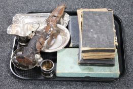 A tray of cased cutlery sets, African carving, cigarette card album,