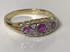 An 18ct gold ruby and diamond ring