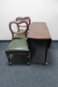 A Victorian mahogany drop leaf table and two balloon back chairs