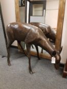 A cast patinated aluminium figure - a doe grazing,