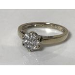 An 18ct gold diamond cluster ring size M, approximately 0.25ct.