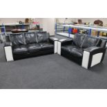 A three seater settee with matching two seater settee upholstered in a two-tone black and white