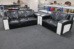 A three seater settee with matching two seater settee upholstered in a two-tone black and white