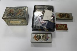 A collection of tins and medals relating to Royal Coronations,