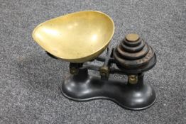 A set of antique kitchen scales with weights