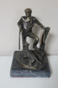 A bronze figure of a gentleman with gun dog on marble base