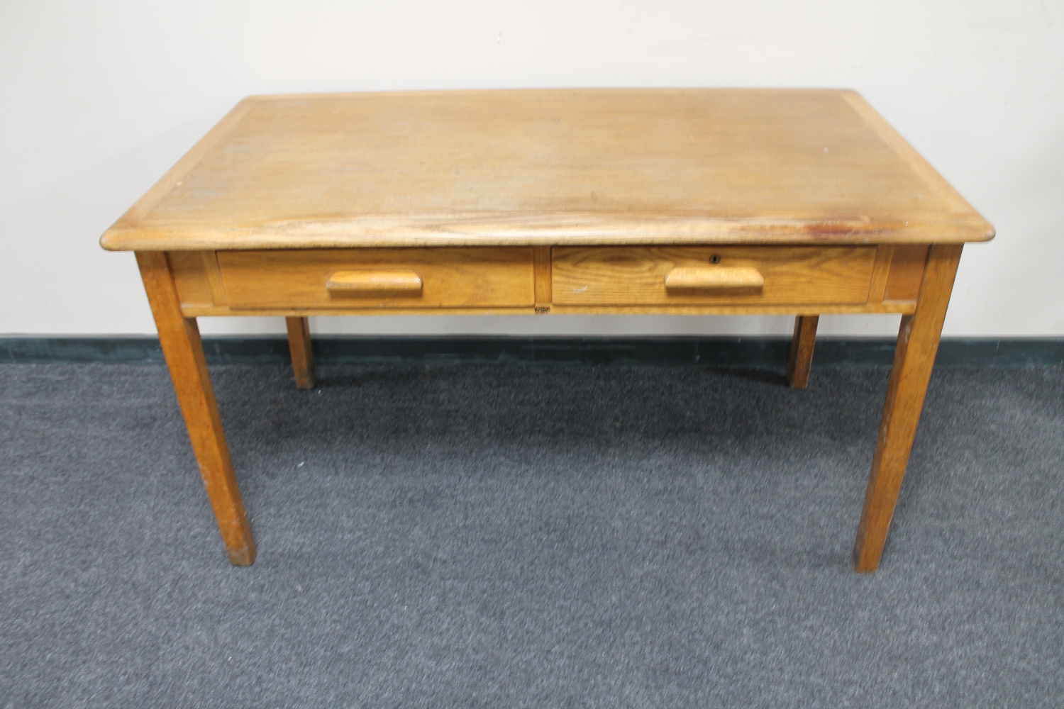 An oak two drawer desk