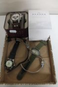 A box containing gent's Fossil wristwatch and others including Skagen, Pulsar,