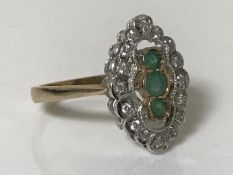 A 9ct gold emerald and diamond ring