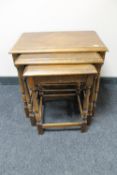 A nest of three oak tables