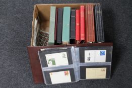 A box of a quantity of stamp albums containing a large collection of assorted stamps,