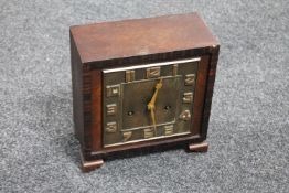An Art Deco oak cased mantel clock