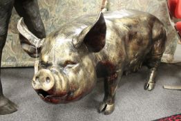 A cast patinated aluminium figure - pig,