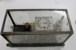 An antique Aron electric meter in case