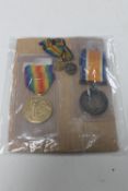 Two WWI medals on ribbons with accompanying miniature medals on ribbons : F. Newby, A.B.