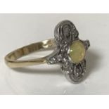 An 18ct gold opal and diamond ring