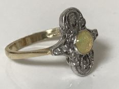 An 18ct gold opal and diamond ring