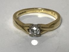 An 18ct gold diamond solitaire ring, approximately 0.2ct, size N 1/2.