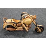 A hand built wooden model of a motorbike