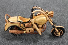 A hand built wooden model of a motorbike