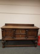 A Victorian oak sideboard with inlaid panel doors,