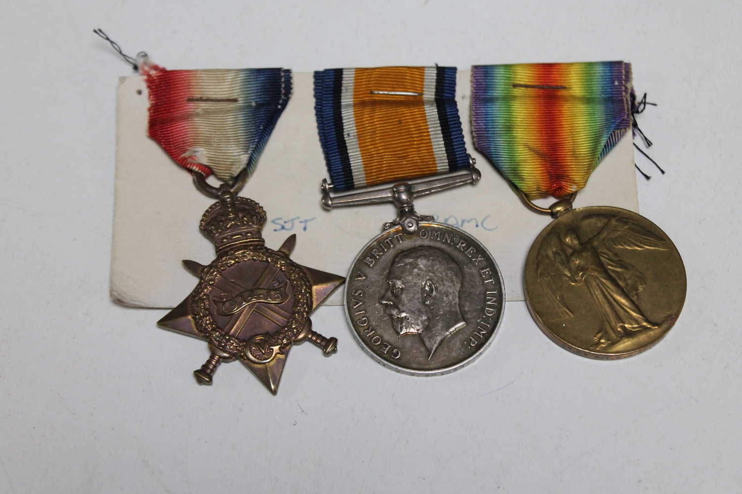 A WWI medal trio comprising 1914-15 Star, British War Medal and Victory Medal, named to 51703 SJT.
