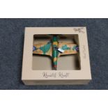 A boxed metal model of a fighter plane