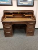 An Edwardian oak roll top desk,
