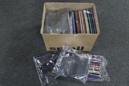 A box of woollen scarves