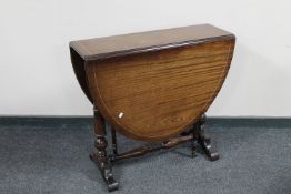 An inlaid mahogany drop leaf table together with a vintage style telephone