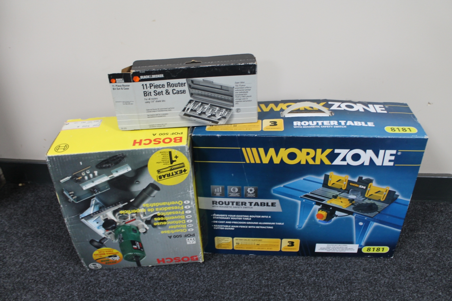 Two boxes of tools including Bosch circular saw, Nutool belt sander, Bosch POF 500A router,