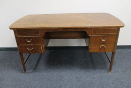 A mid 20th century continental walnut desk