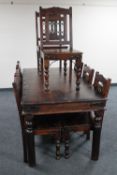 A hardwood dining table and matching set of eight chairs