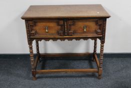 An oak two drawer hall table