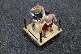 A novelty cast iron boxing money box