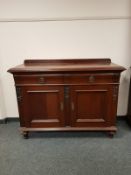 A late Victorian mahogany two drawer sideboard,