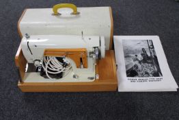 A Frister Rossmann Model 35 electric sewing machine with foot pedal