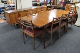 A G-Plan teak dining room suite comprising of extending dining table,