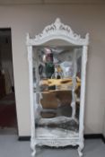 A French style painted cabinet with mirrored back