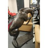 A cast patinated aluminium figure - rutting stag,